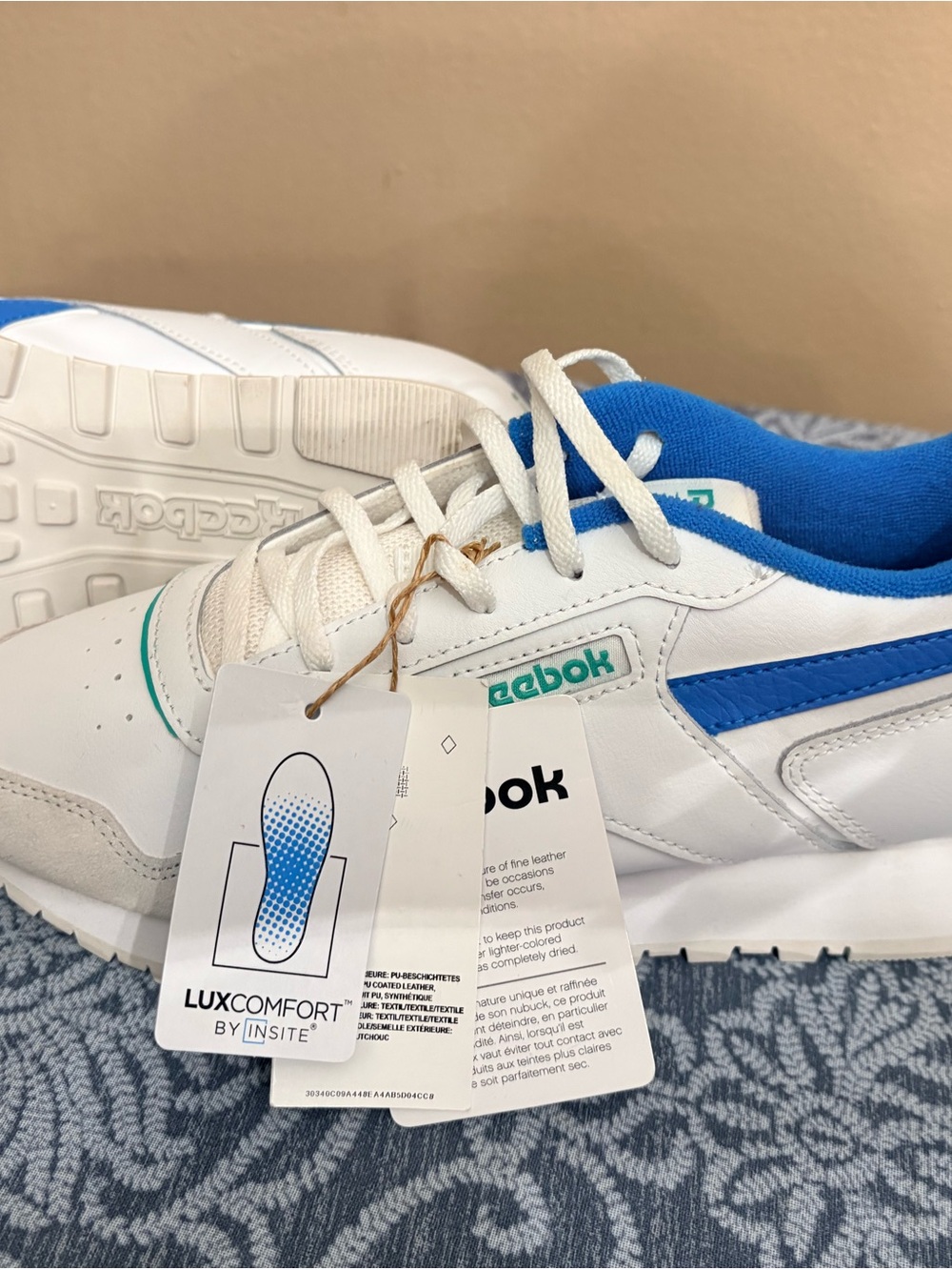 Reebok Kids White Sneakers with Blue Accents